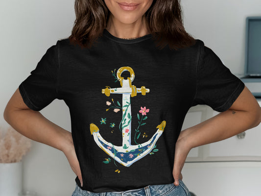 Black t-shirt with a white, blue, and gold anchor design with floral accents.