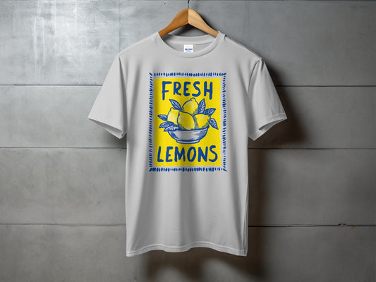 White t-shirt with "FRESH LEMONS" text and a bowl of lemons illustration.