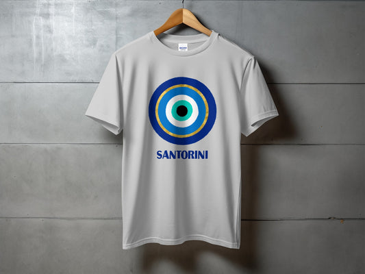 White t-shirt with blue, gold, and white evil eye design and "SANTORINI" text.