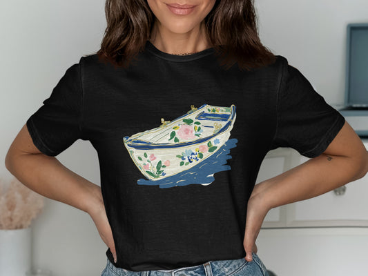 Black t-shirt with a floral painted rowboat illustration.