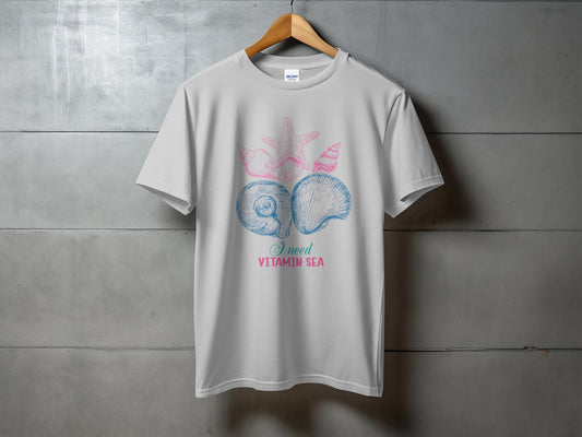 White t-shirt with seashells and text "I need vitamin sea".