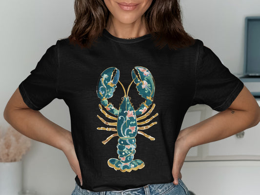 Black t-shirt with a stylized teal and pink floral lobster design.