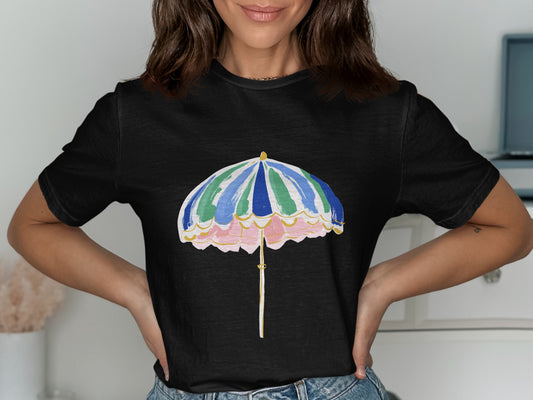 Black t-shirt with a colorful beach umbrella graphic on the front.