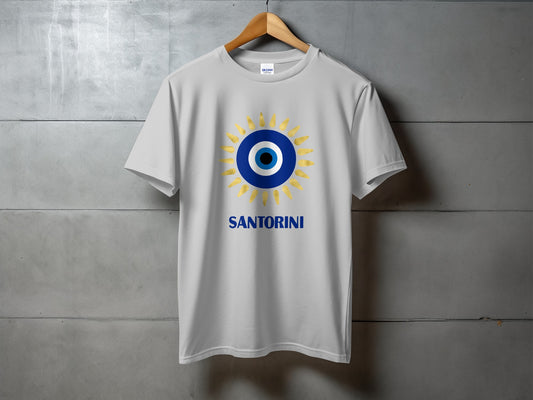 White t-shirt with a blue and gold evil eye design and "Santorini" text.
