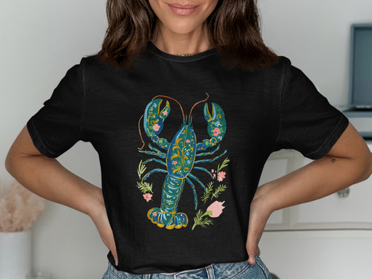 Black t-shirt with a stylized blue and green lobster and floral design.