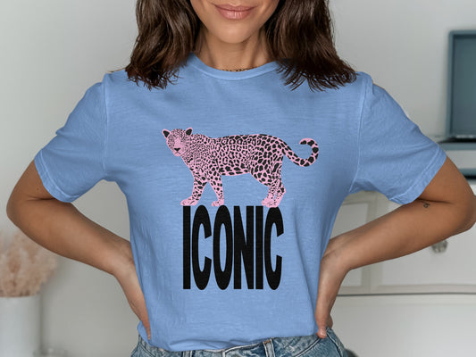 Light blue t-shirt with pink leopard print and the word "ICONIC" in black.