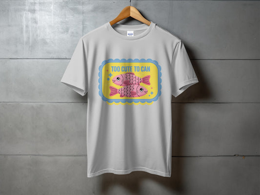 White t-shirt with two pink cartoon fish and text "TOO CUTE TO CAN".