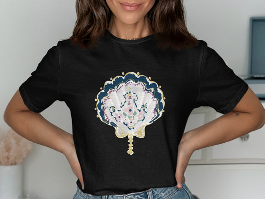 Black t-shirt with a detailed, colorful seashell graphic featuring floral accents.