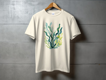 Cream t-shirt with abstract watercolor seaweed and plant design.