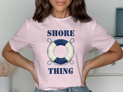Pink t-shirt with blue and white life preserver graphic and "SHORE THING" text.