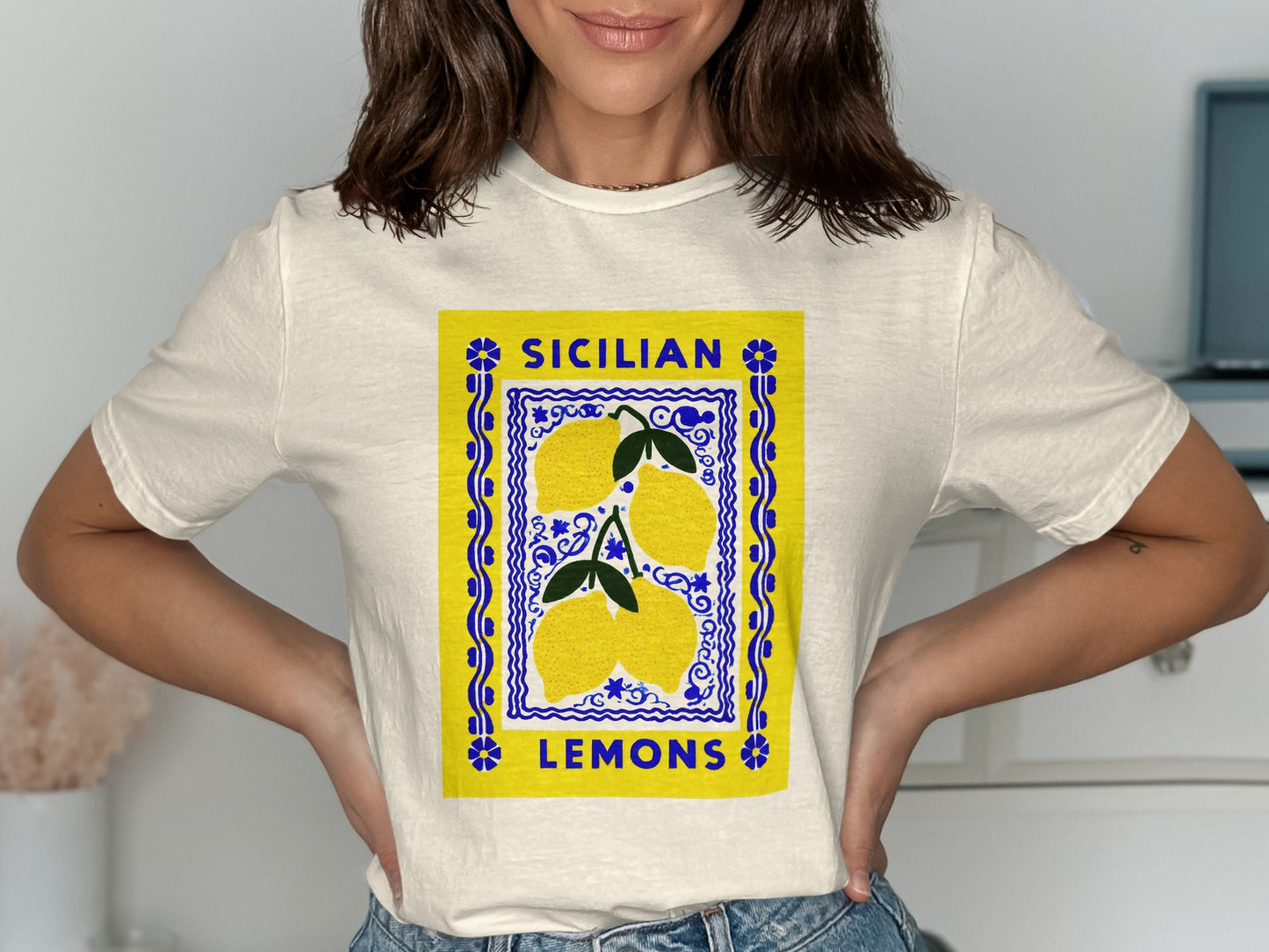 Cream t-shirt with "SICILIAN LEMONS" text and yellow lemon illustration.