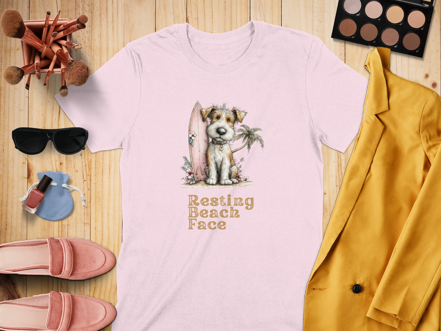 Dog with surfboard and palm tree graphic on pink t-shirt.