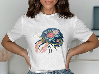 White t-shirt with a detailed floral hermit crab design.