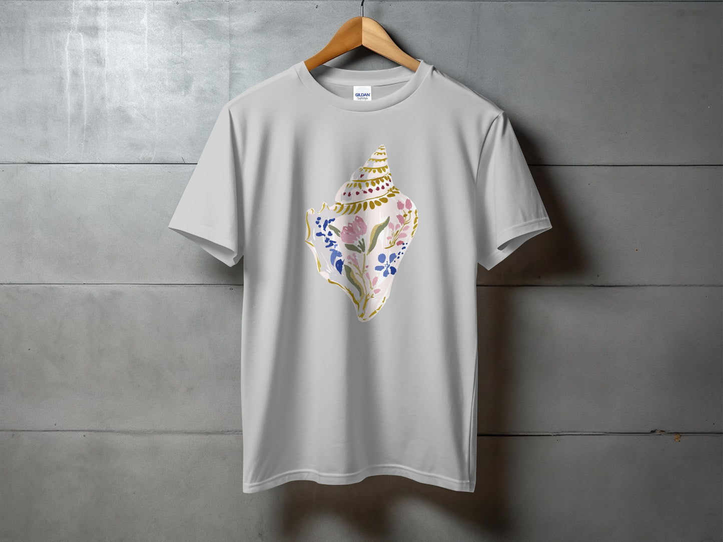 Grey t-shirt with a watercolor seashell design featuring pink flowers.