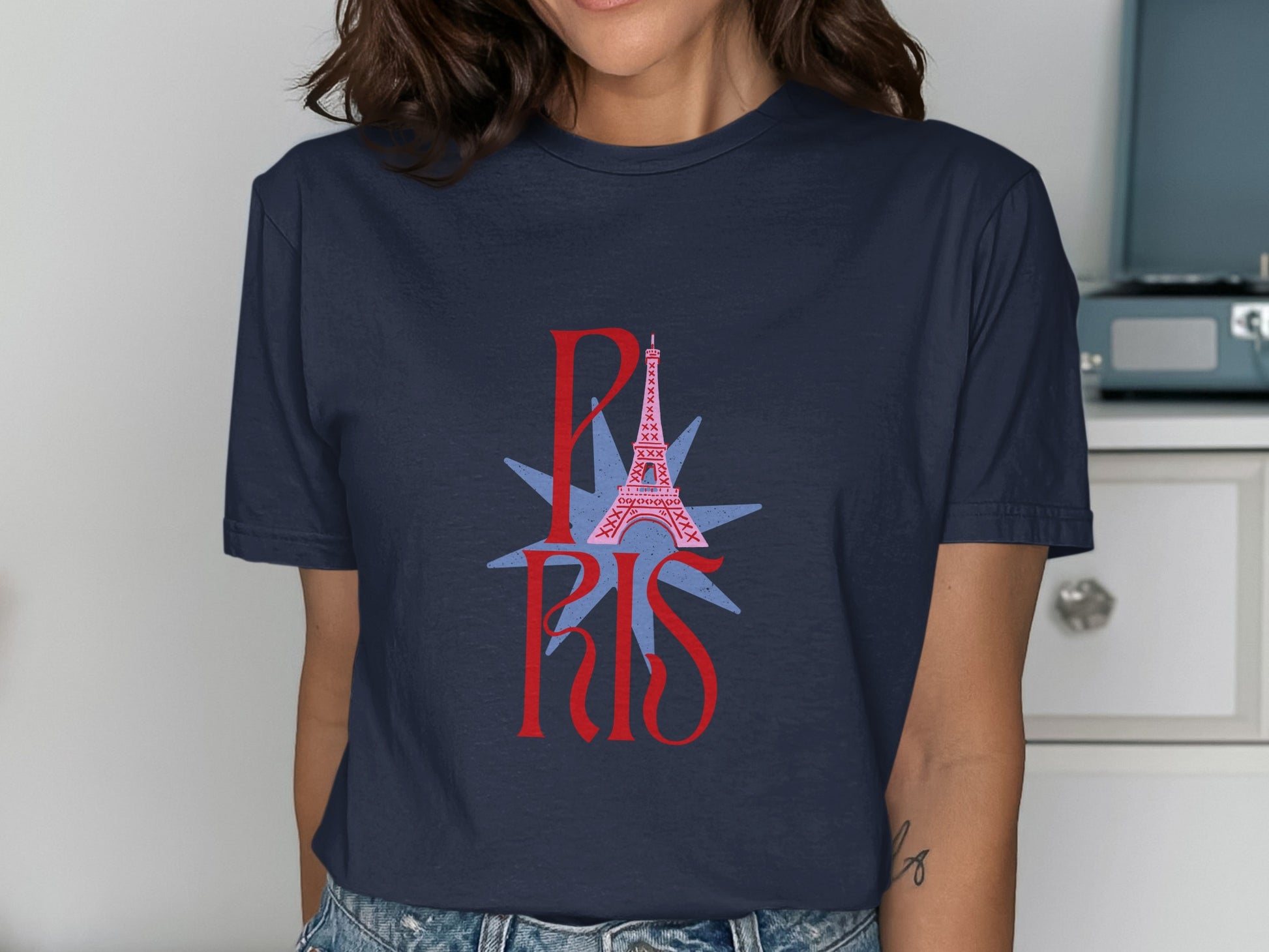 Navy t-shirt with pink Eiffel Tower and red "PARIS" text.