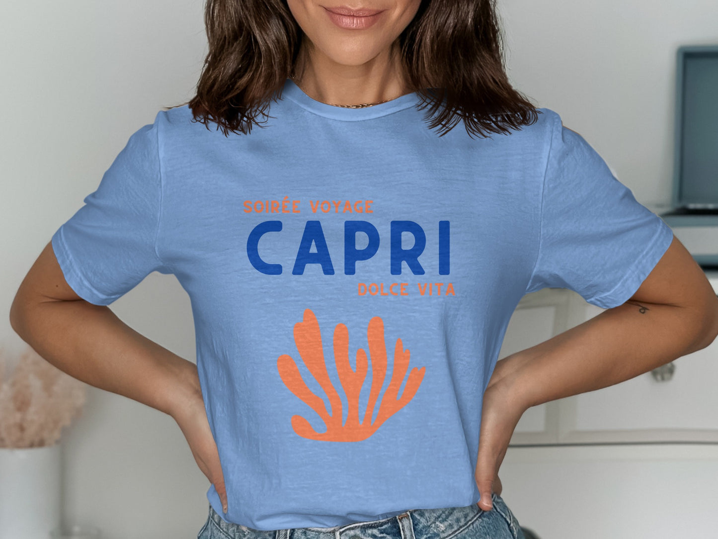 Blue t-shirt with "CAPRI DOLCE VITA" and orange coral design.