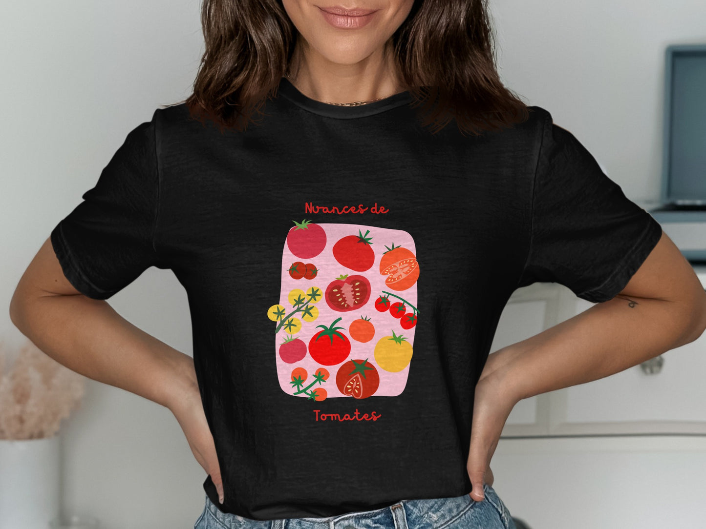 Black t-shirt with graphic of various tomatoes and text "Nuances de Tomates".