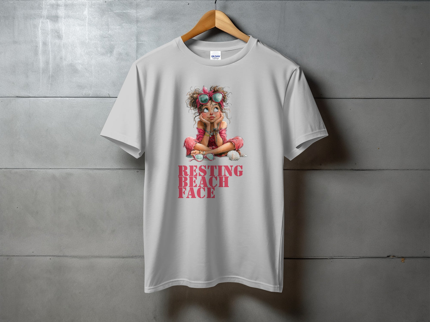 White t-shirt with "RESTING BEACH FACE" graphic of a girl wearing sunglasses.