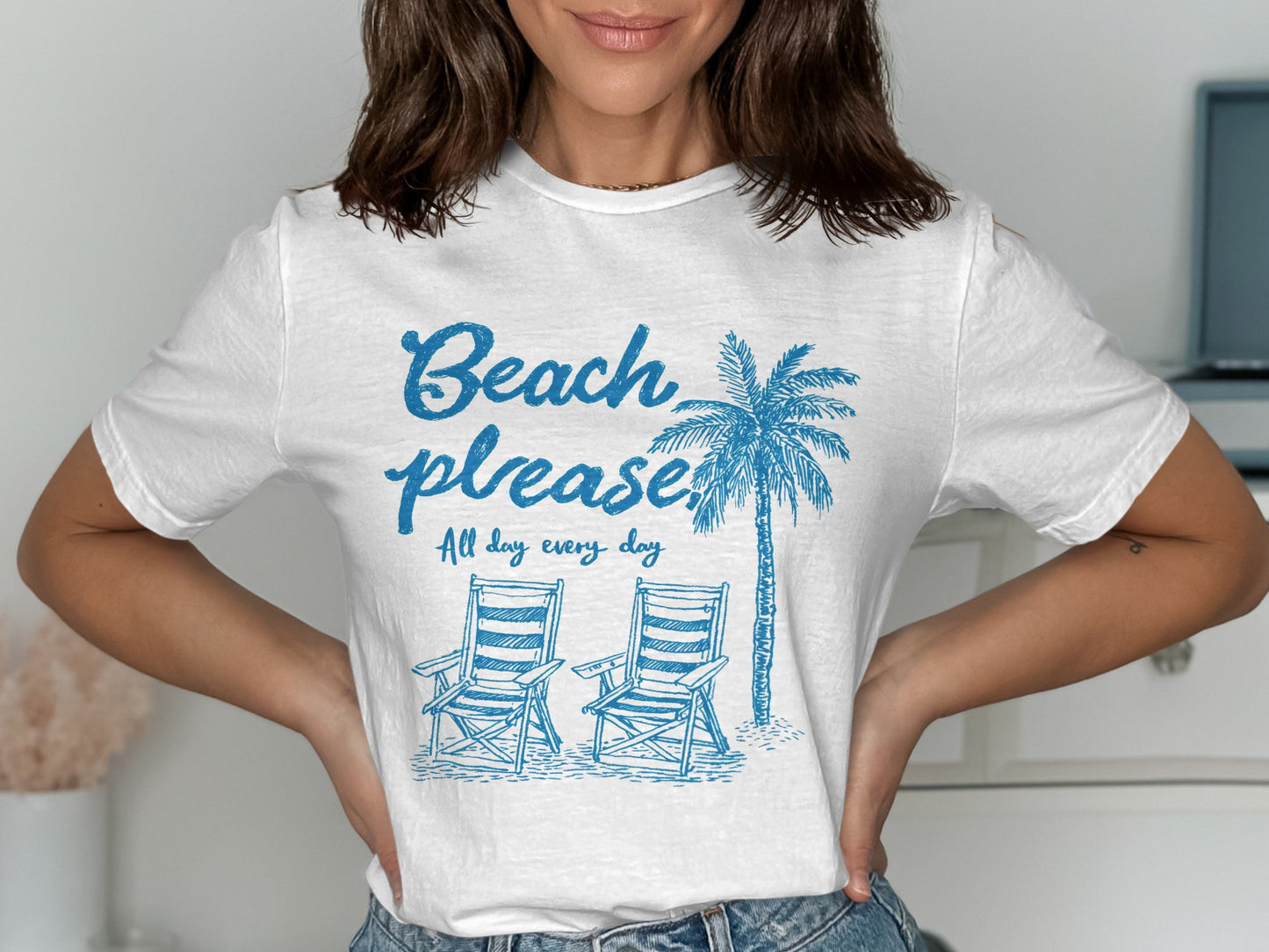 White t-shirt with "Beach please" and palm tree graphic.