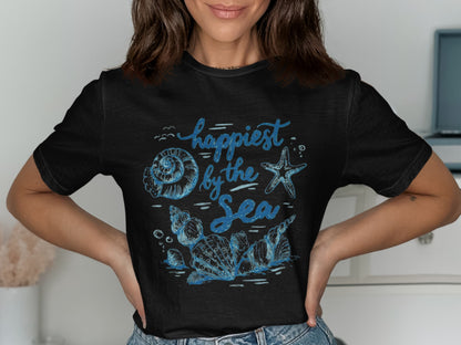 Black t-shirt with blue "Happiest by the Sea" text and shell graphics.
