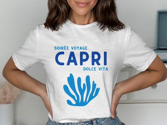 White t-shirt with blue text "SOIRÉE VOYAGE CAPRI DOLCE VITA" and coral graphic.