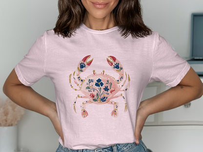 Pink t-shirt with a floral crab illustration.