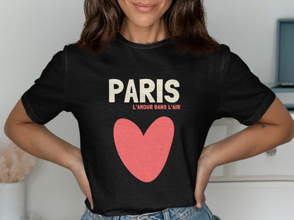 Black t-shirt with "PARIS L'AMOUR DANS L'AIR" text and a large pink heart.