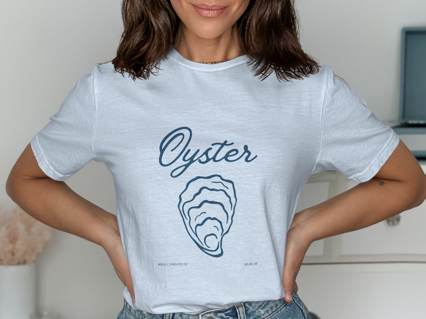 White t-shirt with "Oyster" text and graphic, "WHATEVER'S GREATEST" and date.