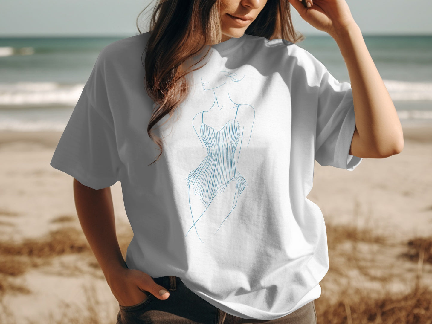 White t-shirt featuring a blue line drawing of a woman in a swimsuit.