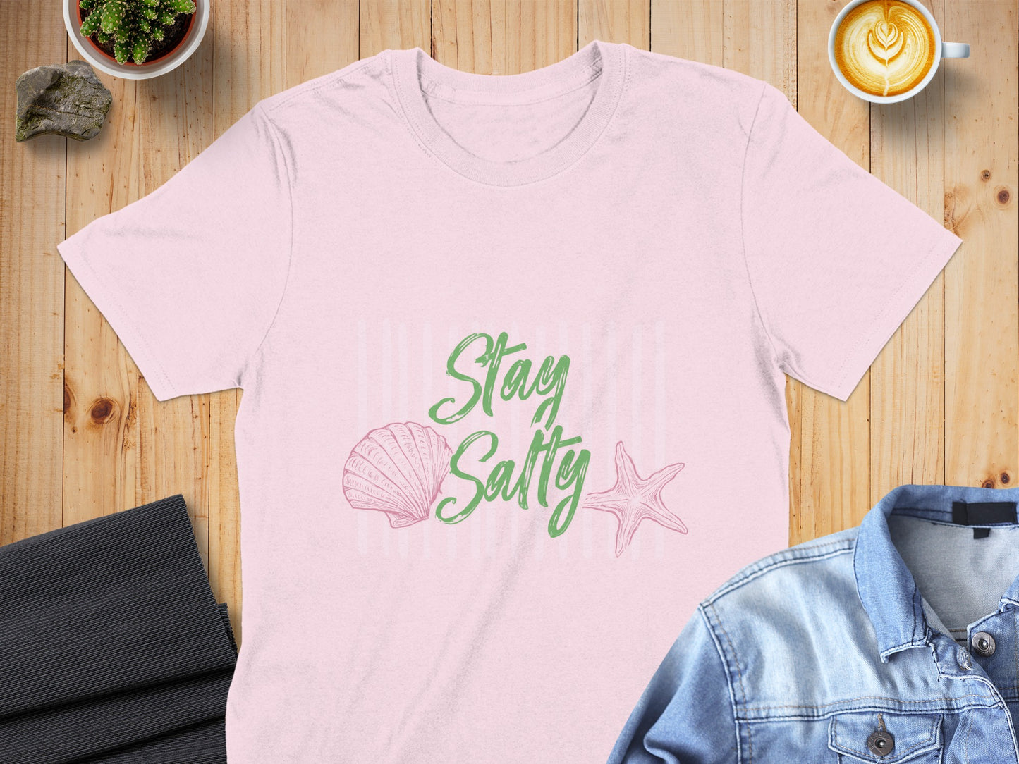 Pink t-shirt with "Stay Salty" text and seashell graphics.