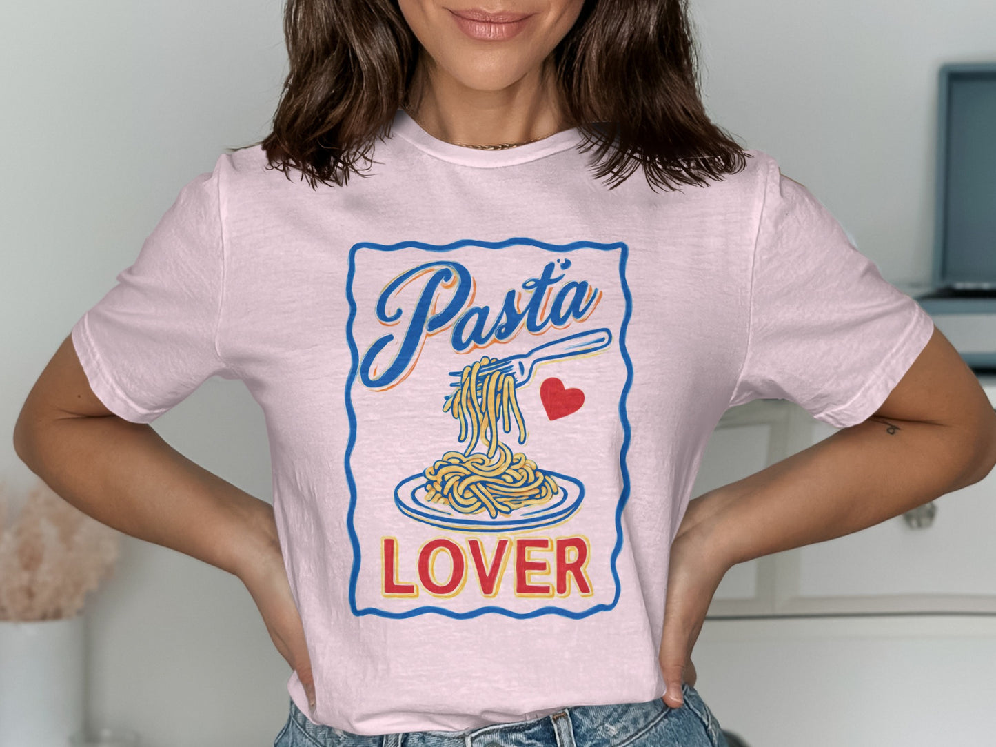 Pink t-shirt with "Pasta Lover" text and spaghetti on a plate.