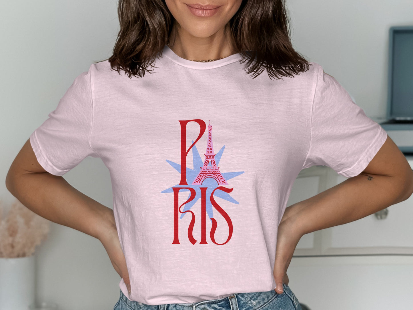 Pink t-shirt with a stylized Eiffel Tower and "PARIS" text.