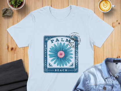 Blue daisy graphic with "Palm Beach" text on a white t-shirt.