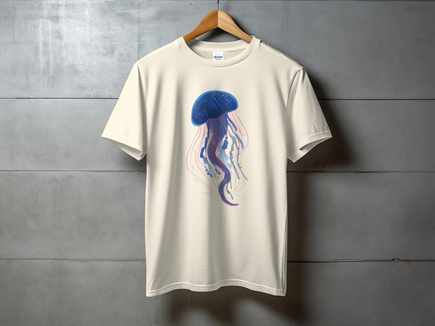 Cream t-shirt with a colorful jellyfish illustration.
