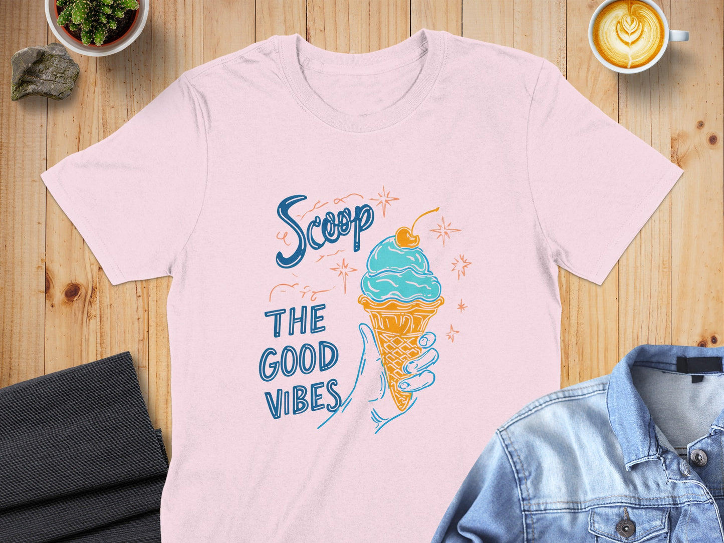 Pink t-shirt with ice cream cone and "Scoop the Good Vibes" text.