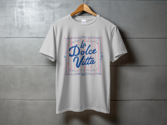 White t-shirt with "La Dolce Vita" text and decorative blue and pink lines.