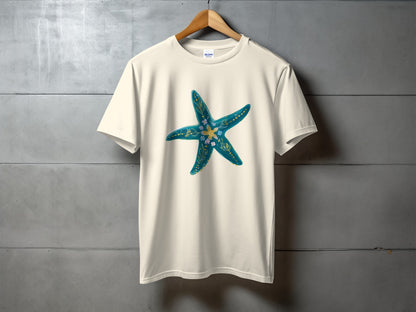 Cream t-shirt with a teal and gold starfish design.