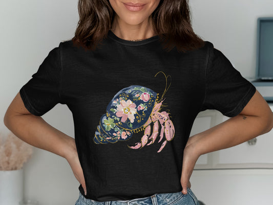 Black t-shirt featuring a whimsical floral hermit crab design.