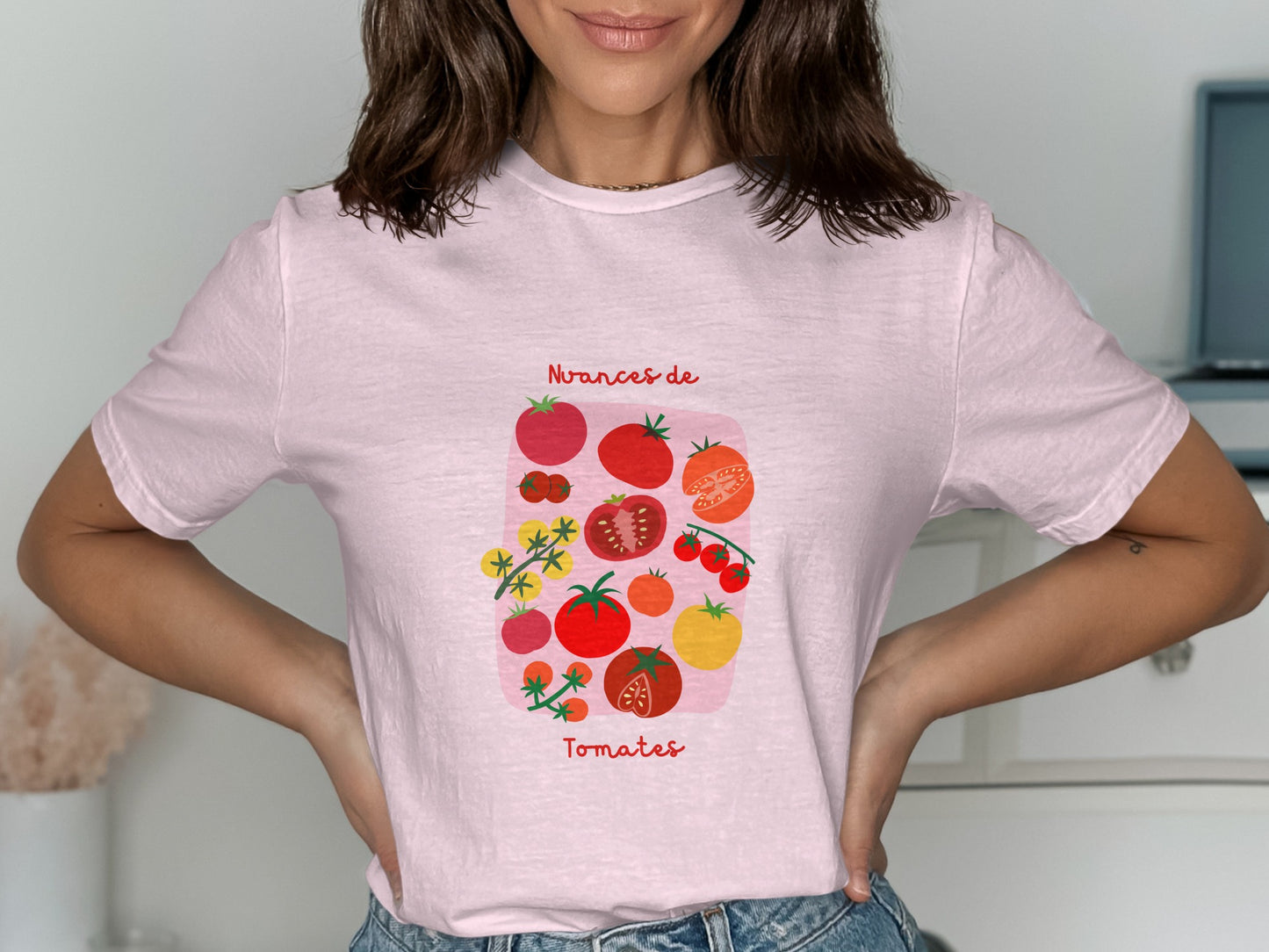 Pink t-shirt with colorful tomato illustrations and the text "Nuances de Tomates".