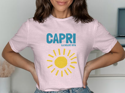 Pink t-shirt with "CAPRI LA DOLCE VITA" text and a yellow sun graphic.