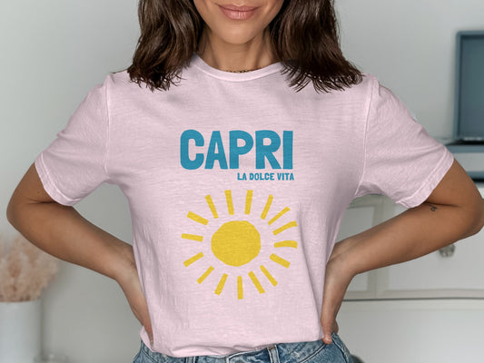 Pink t-shirt with "CAPRI LA DOLCE VITA" text and a yellow sun graphic.