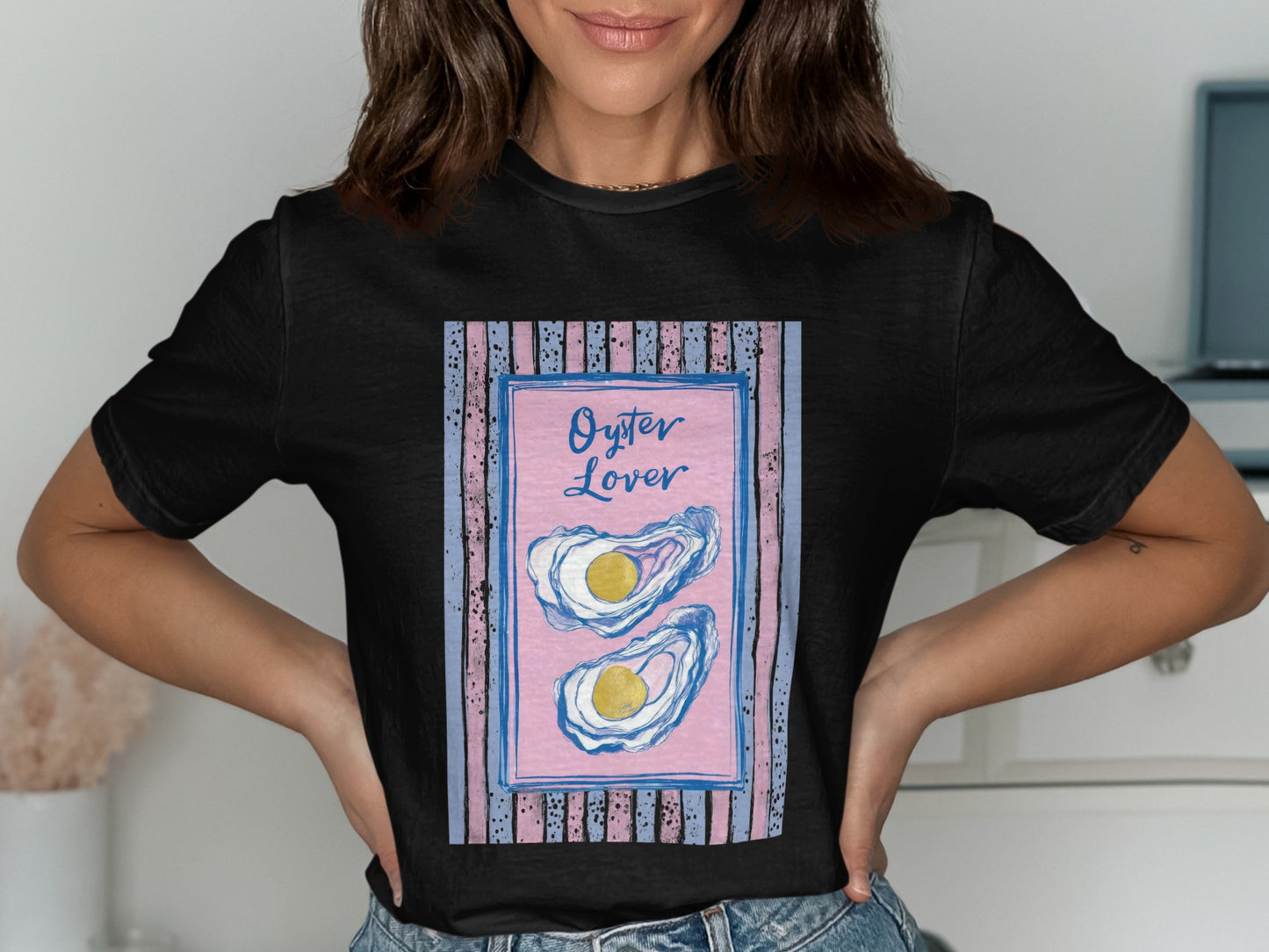 Black t-shirt featuring a framed illustration of two oysters with text "Oyster Lover".