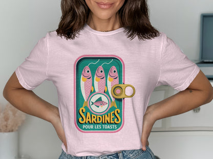 Pink t-shirt with a graphic of a sardines can labeled "Sardines Pour Les Toasts".
