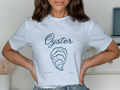 White t-shirt with blue text: "Oyster" above an oyster shell illustration and "#WEALLTREA TSITE".