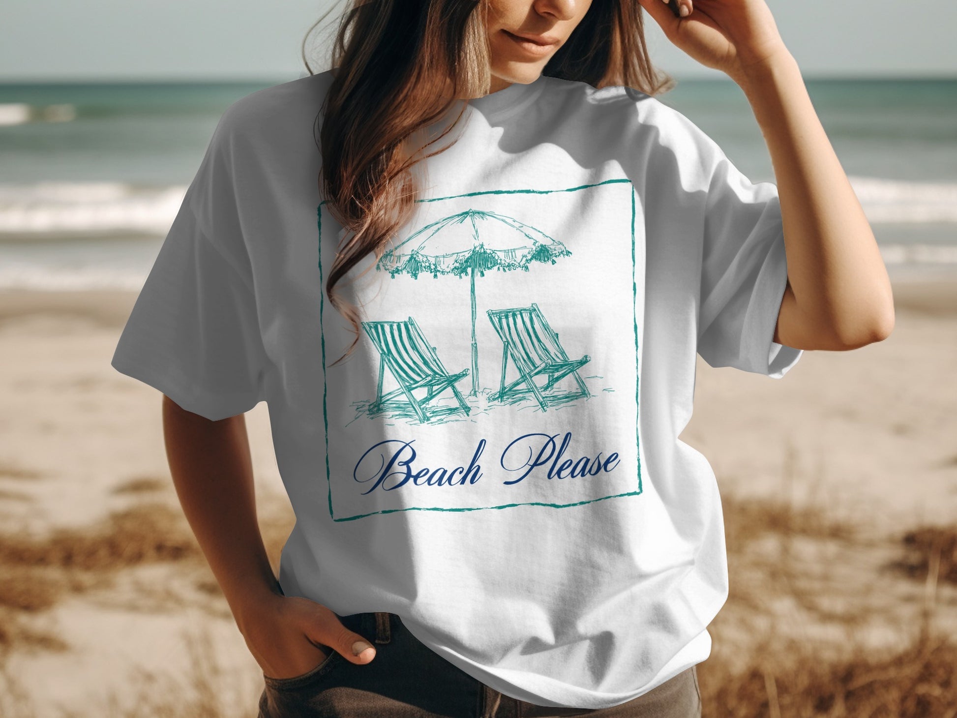 White t-shirt with a sketch of beach chairs and umbrella, and text "Beach Please".