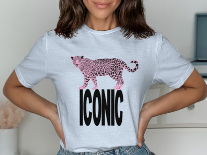 White t-shirt with a pink leopard print and the word ICONIC.