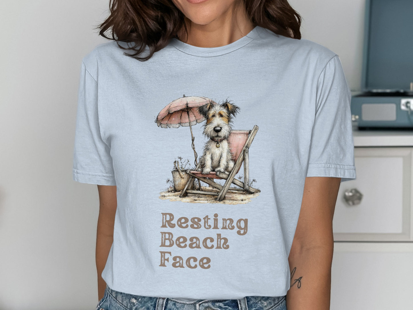 Dog in a beach chair under an umbrella, text "Resting Beach Face".