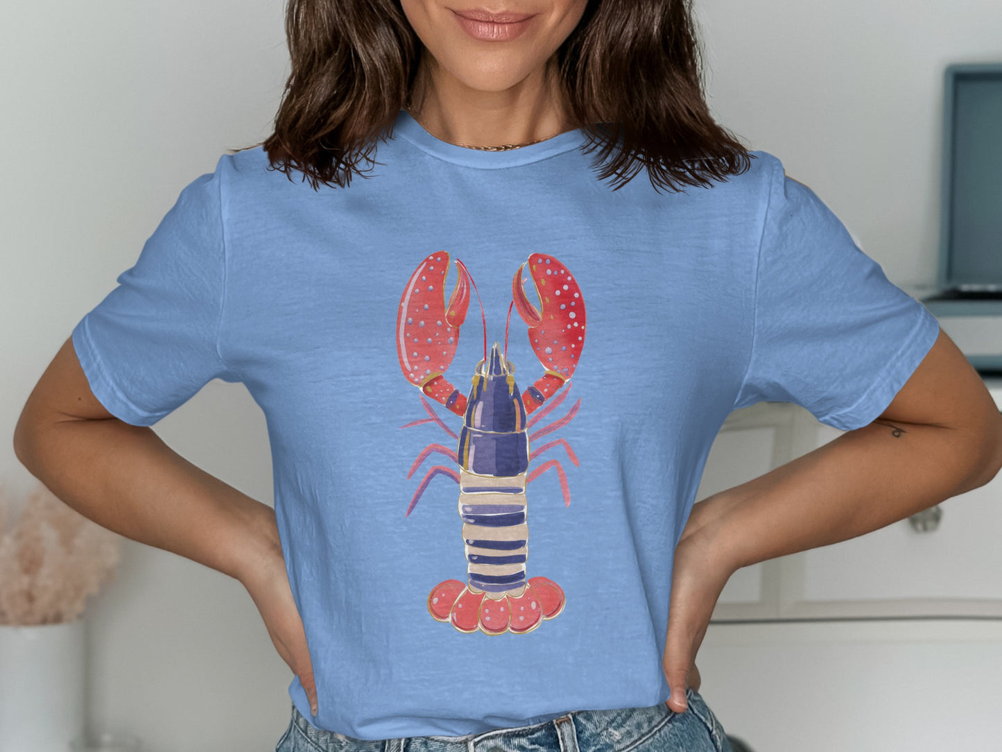 Light blue t-shirt with a stylized red lobster graphic.