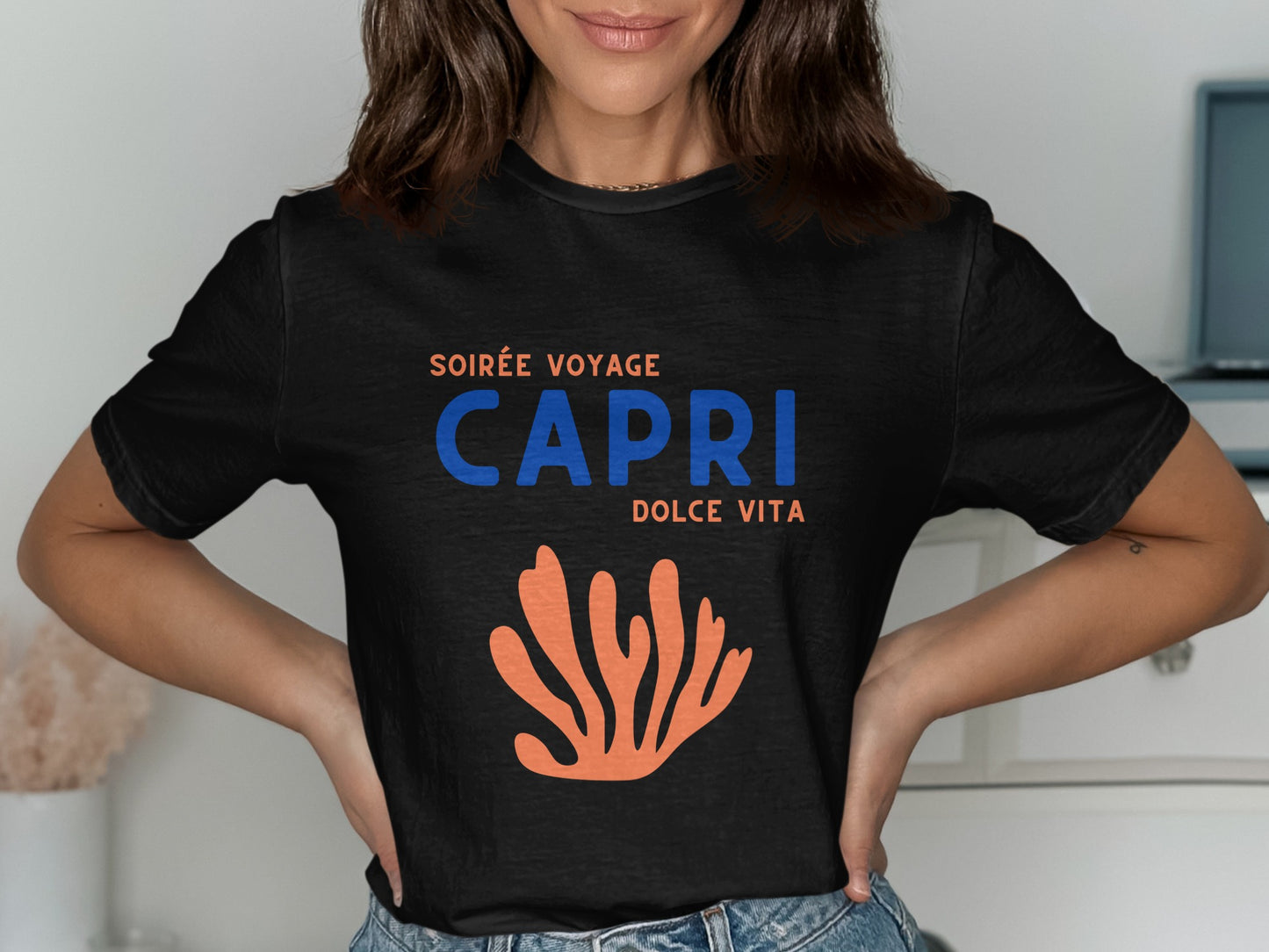 Black t-shirt with CAPRI DOLCE VITA text and coral graphic.