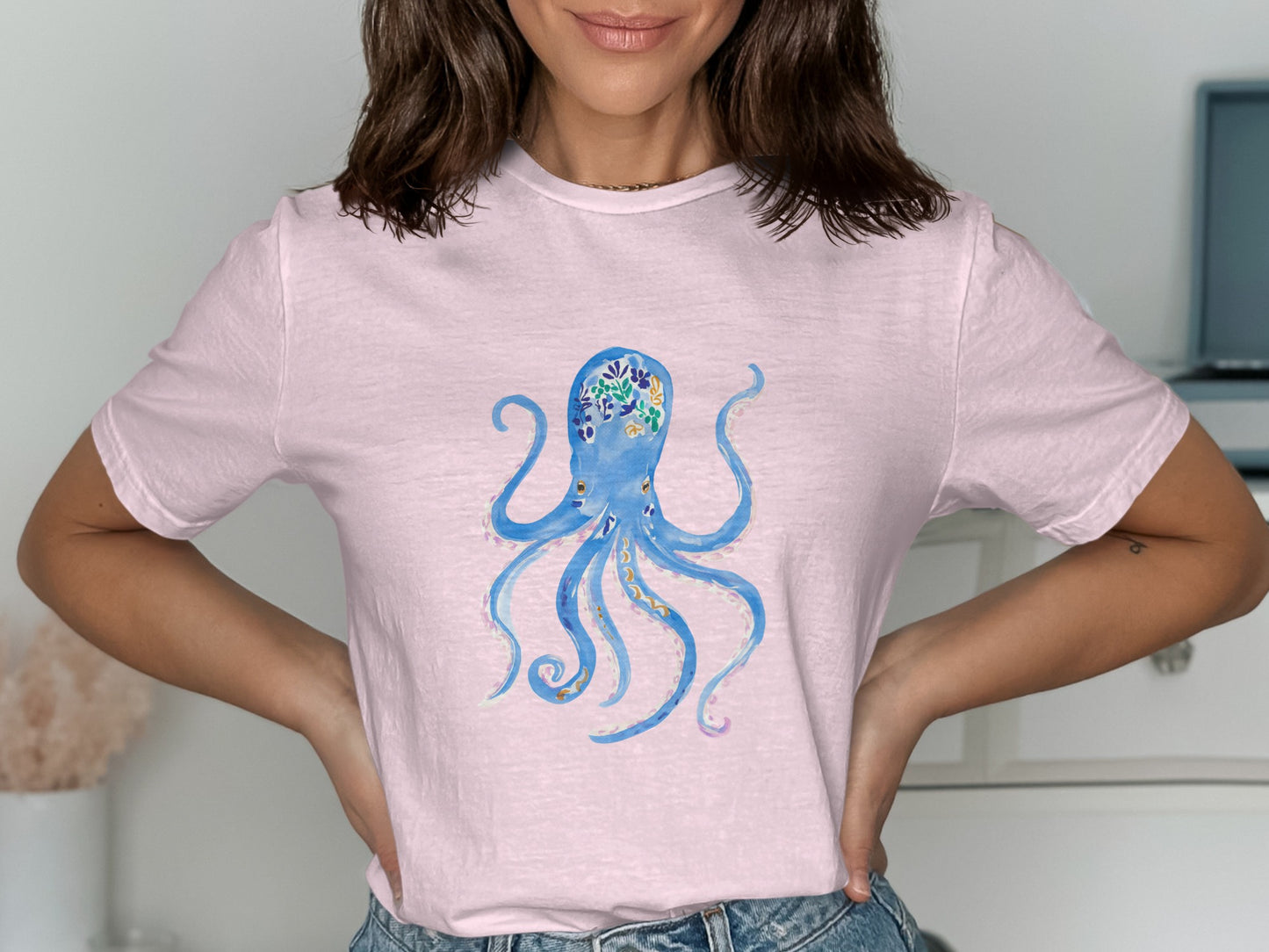 Light pink t-shirt with a blue watercolor octopus design.